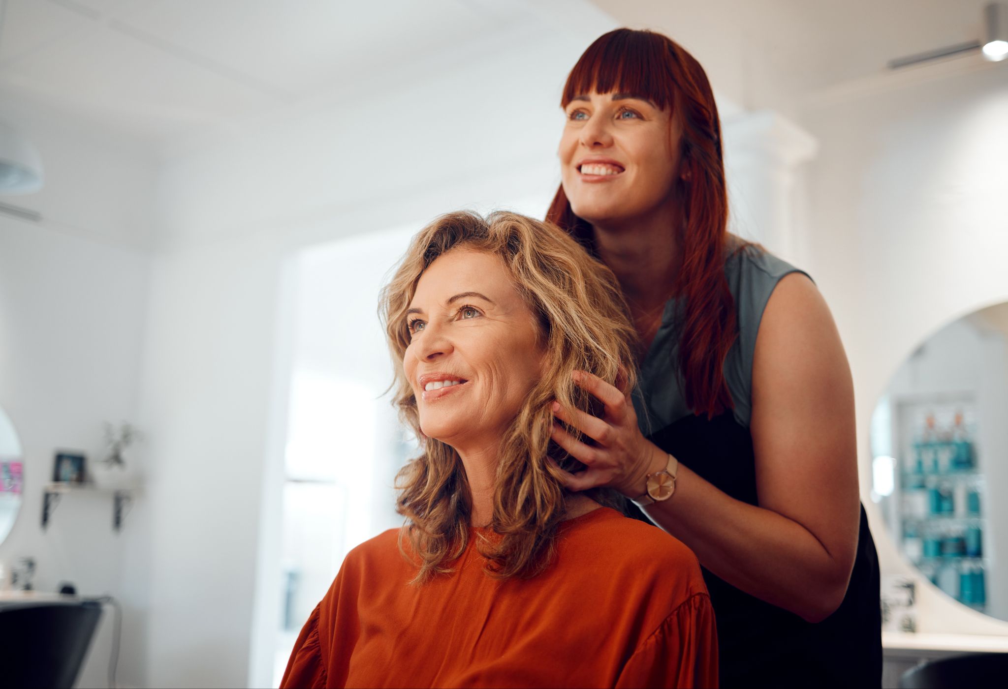 Studio T Salon stylist working with a client experiencing hair loss in Crystal Lake, IL