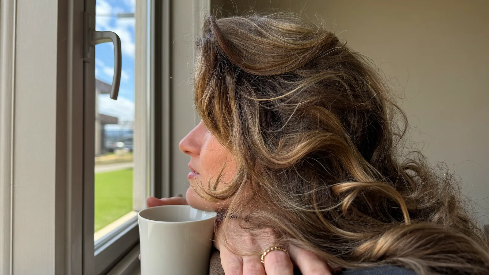 Woman with long, full hair after choosing the right hair topper