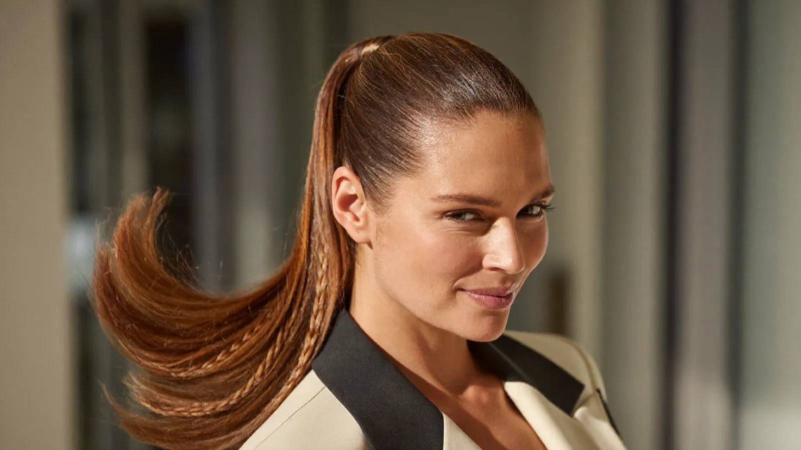 Woman with a sleek, tight high ponytail